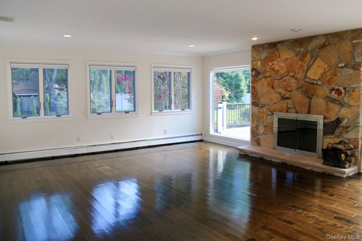 Empty room, Fireplace, Interior, Recessed Lighting, Stone Walls, Wood Texture Flooring