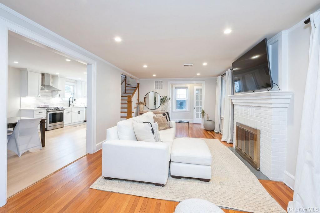 Fireplace, Interior, Kitchen, Living room, Recessed Lighting, Stainless Steel Appliances, Wood Texture Flooring