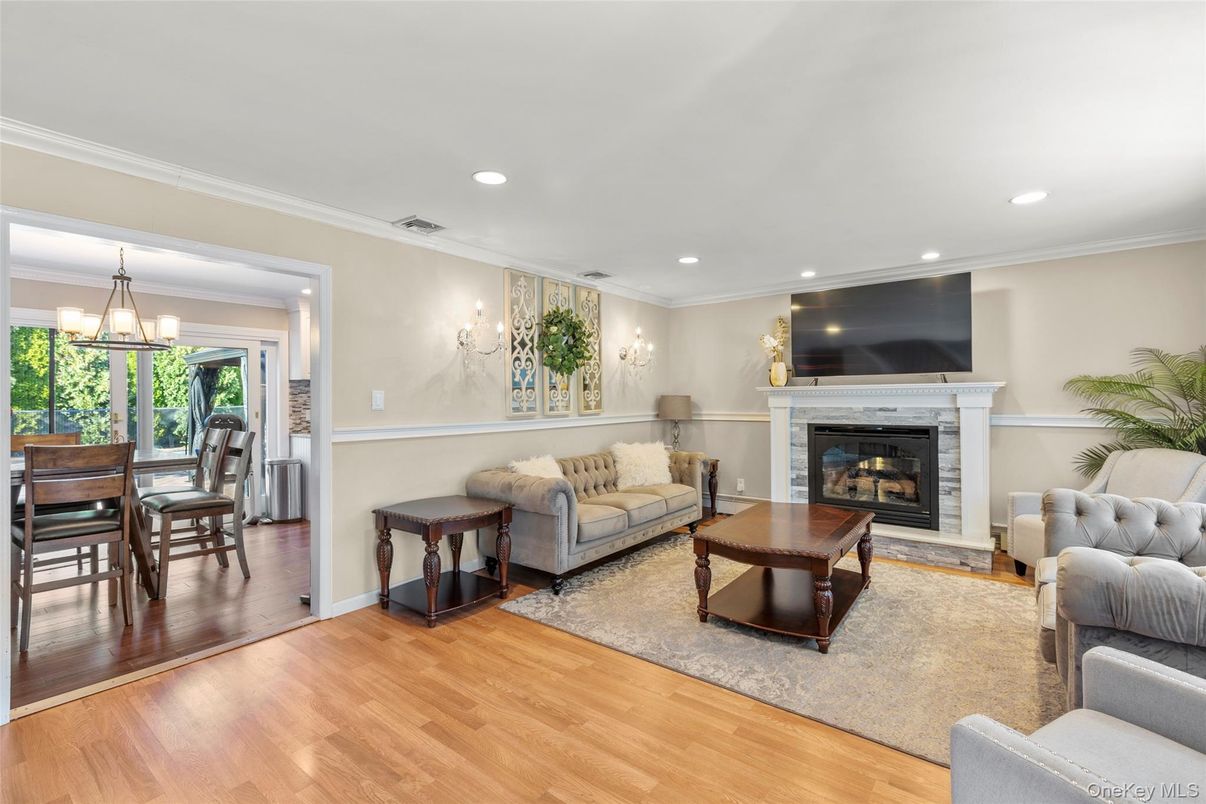 Chandelier, Dining room, Fireplace, Interior, Living room, Recessed Lighting, Wood Texture Flooring