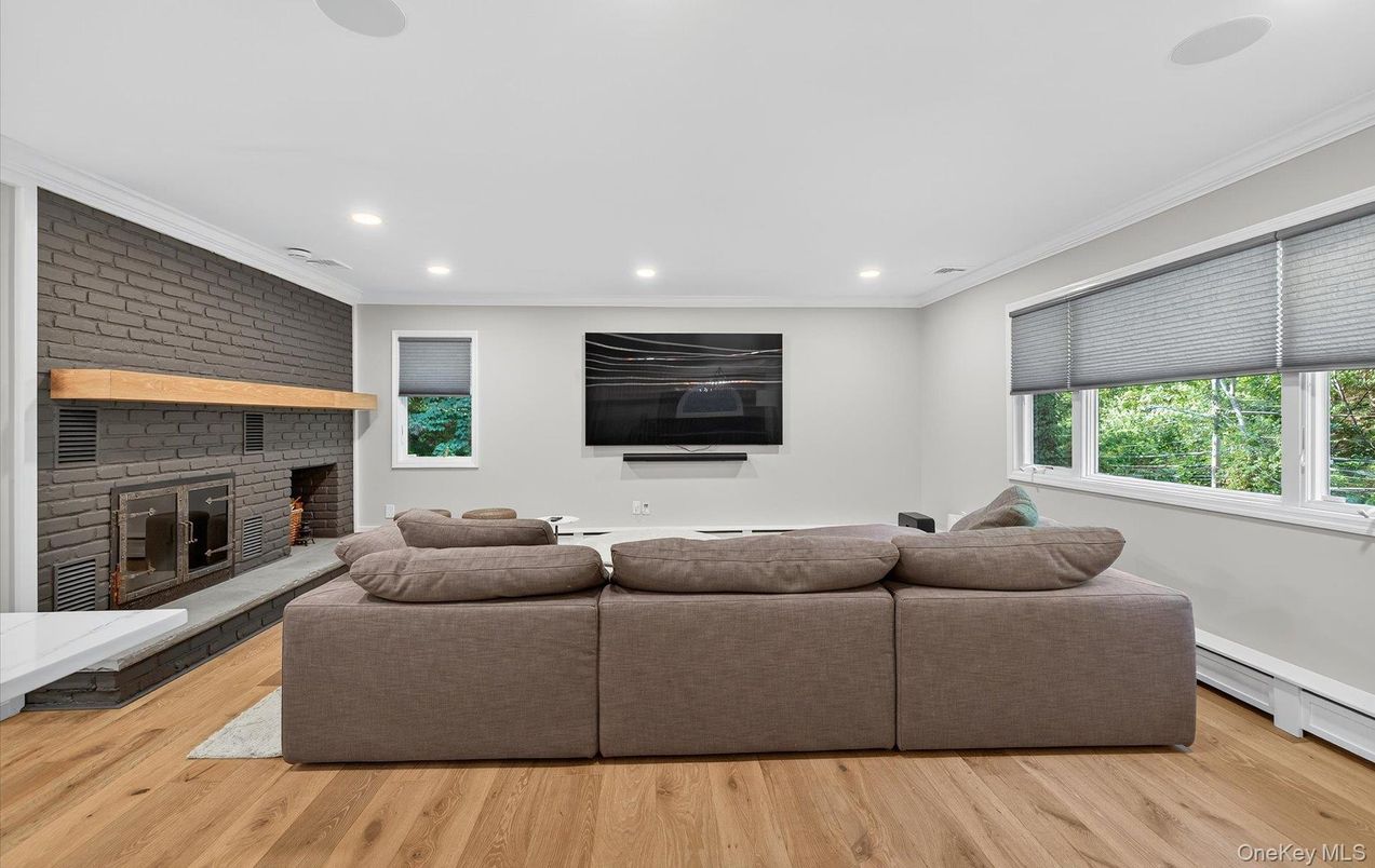 Fireplace, Interior, Living room, Recessed Lighting, Stone Walls, Wood Texture Flooring