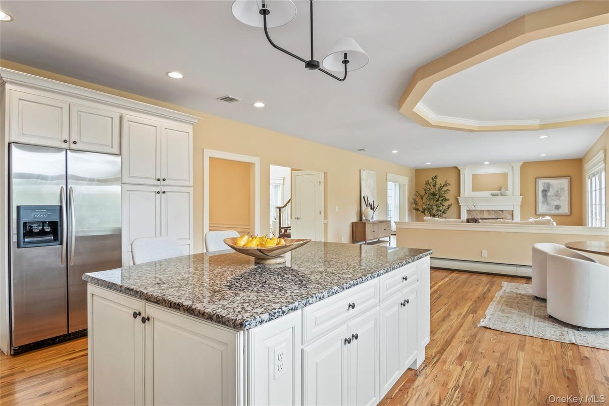 Fireplace, Interior, Kitchen, Recessed Lighting, Stainless Steel Appliances, Wood Texture Flooring