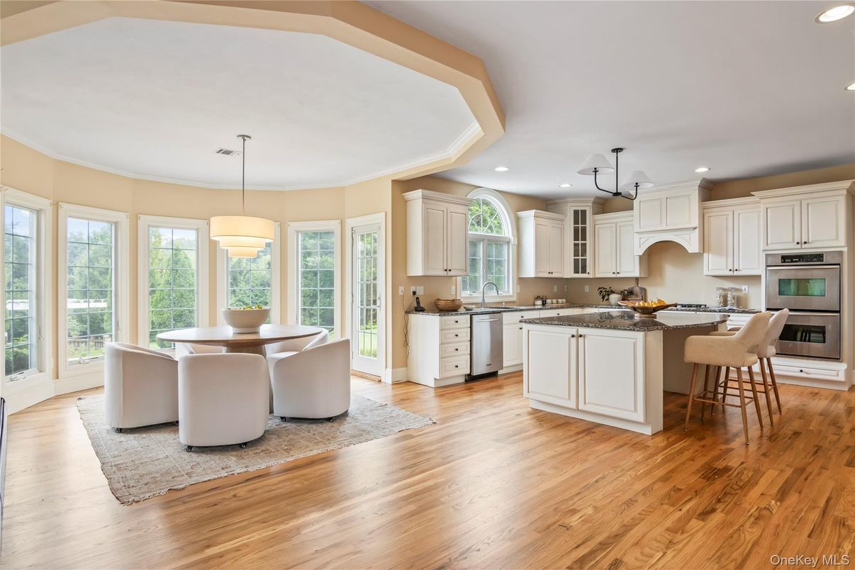 Dining room, Interior, Kitchen, Pendant Lights, Recessed Lighting, Stainless Steel Appliances, Wood Texture Flooring