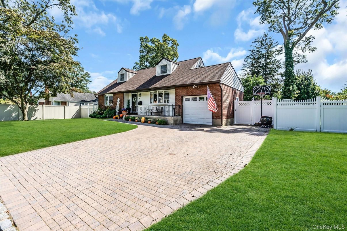 Attached, Backyard, Exterior, Facade, Brick Facade, Cape Cod