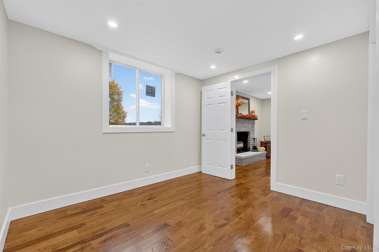 Empty room, Fireplace, Interior, Recessed Lighting, Wood Texture Flooring