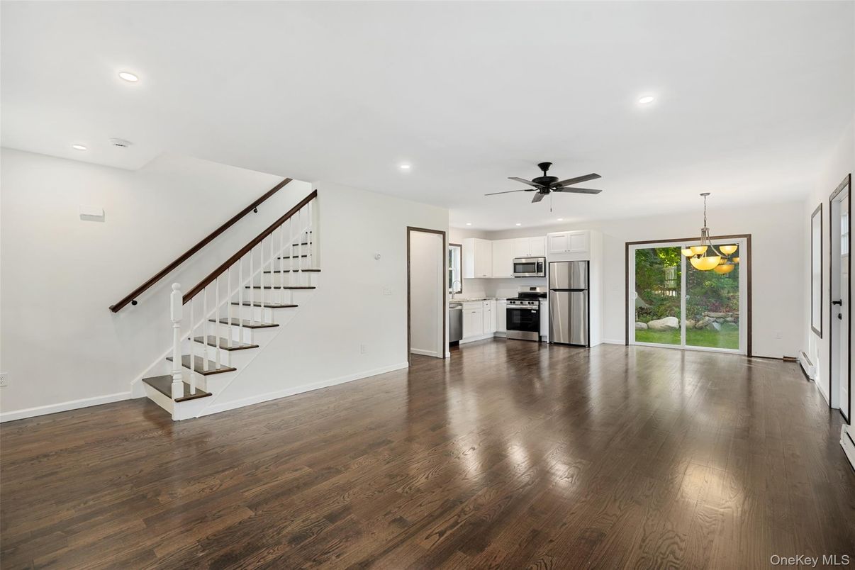 Empty room, Interior, Kitchen, Pendant Lights, Recessed Lighting, Stainless Steel Appliances, Wood Texture Flooring
