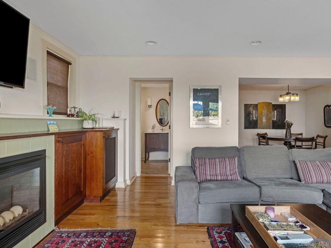 Dining room, Fireplace, Interior, Living room, Pendant Lights, Recessed Lighting, Wood Texture Flooring