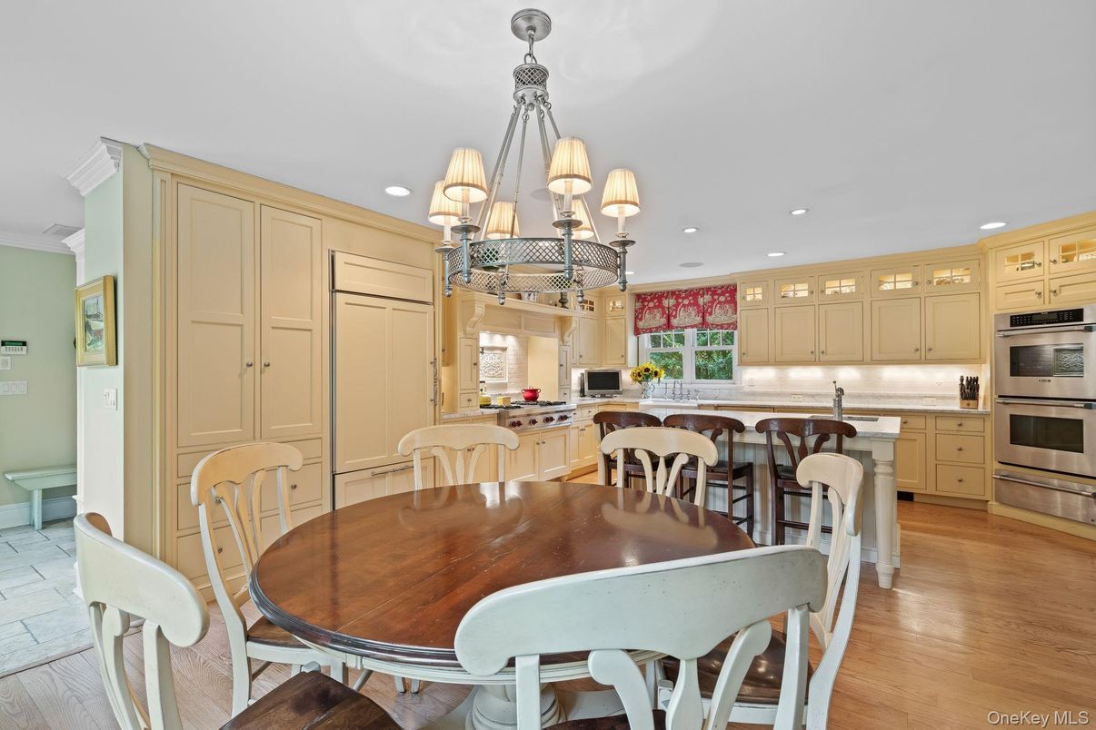 Chandelier, Dining room, Interior, Kitchen, Recessed Lighting, Stainless Steel Appliances, Wood Texture Flooring