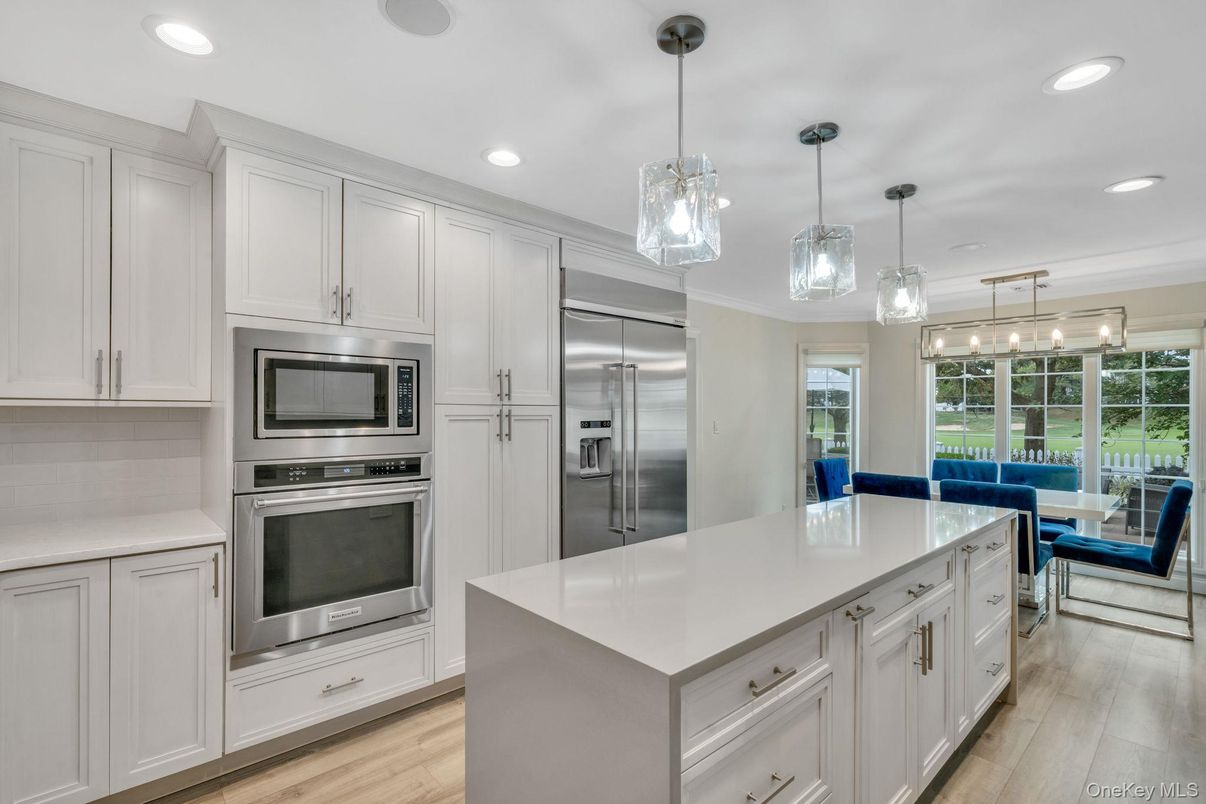 Dining room, Interior, Kitchen, Pendant Lights, Recessed Lighting, Stainless Steel Appliances, Wood Texture Flooring