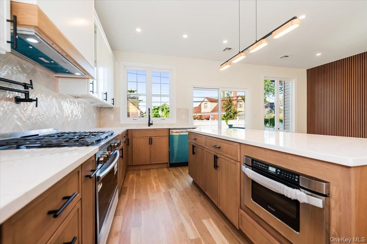 Interior, Kitchen, Pendant Lights, Recessed Lighting, Stainless Steel Appliances, Wood Texture Flooring