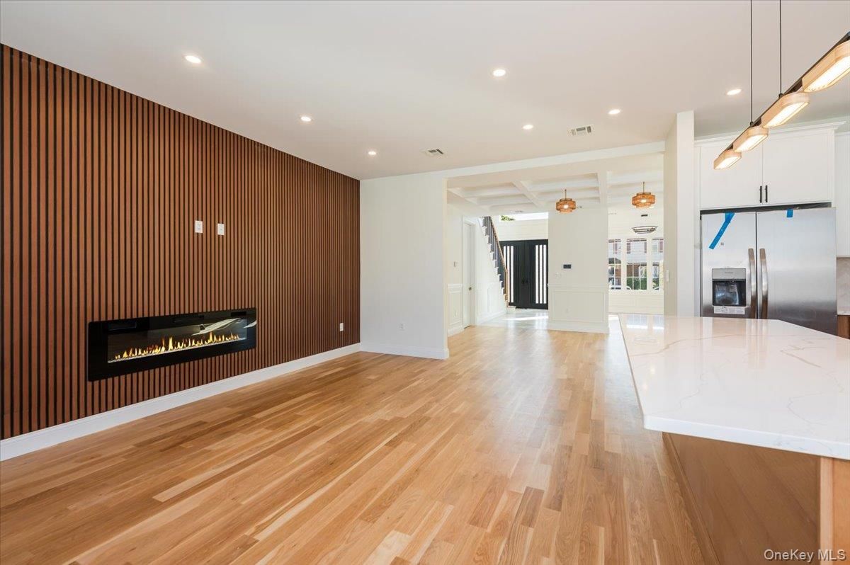 Empty room, Fireplace, Interior, Kitchen, Pendant Lights, Recessed Lighting, Wood Texture Flooring
