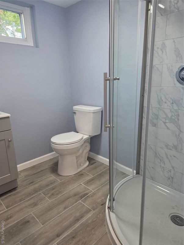 Bathroom, Glass Shower, Interior, Marble Walls, Wood Texture Flooring