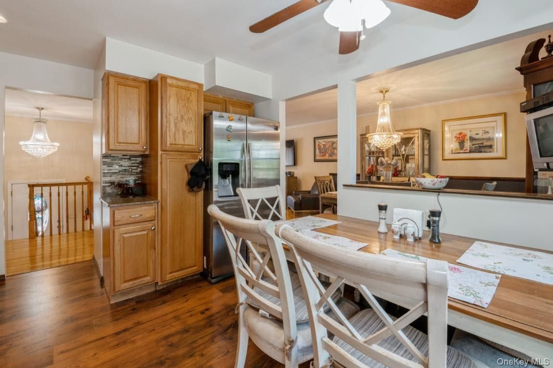 Chandelier, Dining room, Interior, Kitchen, Stainless Steel Appliances, Wood Texture Flooring