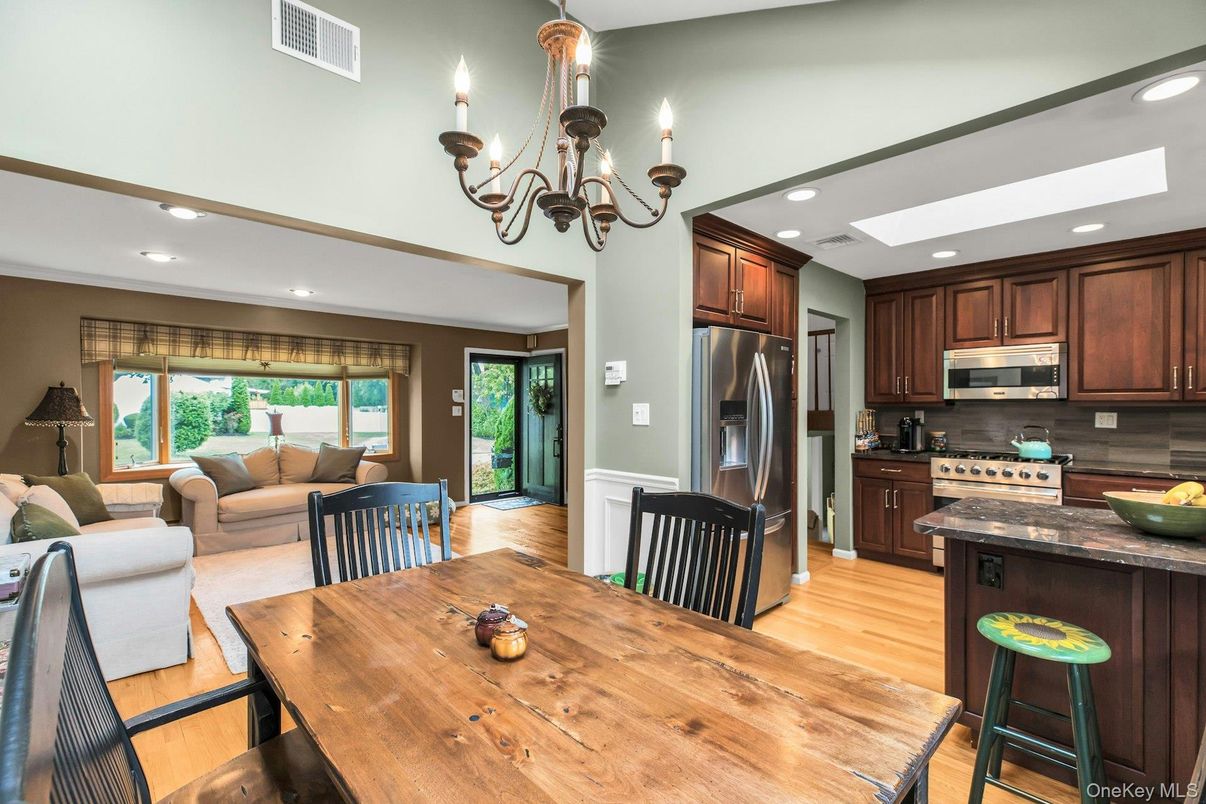 Chandelier, Dining room, Interior, Kitchen, Living room, Recessed Lighting, Stainless Steel Appliances, Wood Texture Flooring