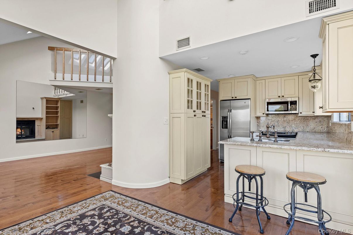 Fireplace, Interior, Kitchen, Pendant Lights, Recessed Lighting, Stainless Steel Appliances, Wood Texture Flooring