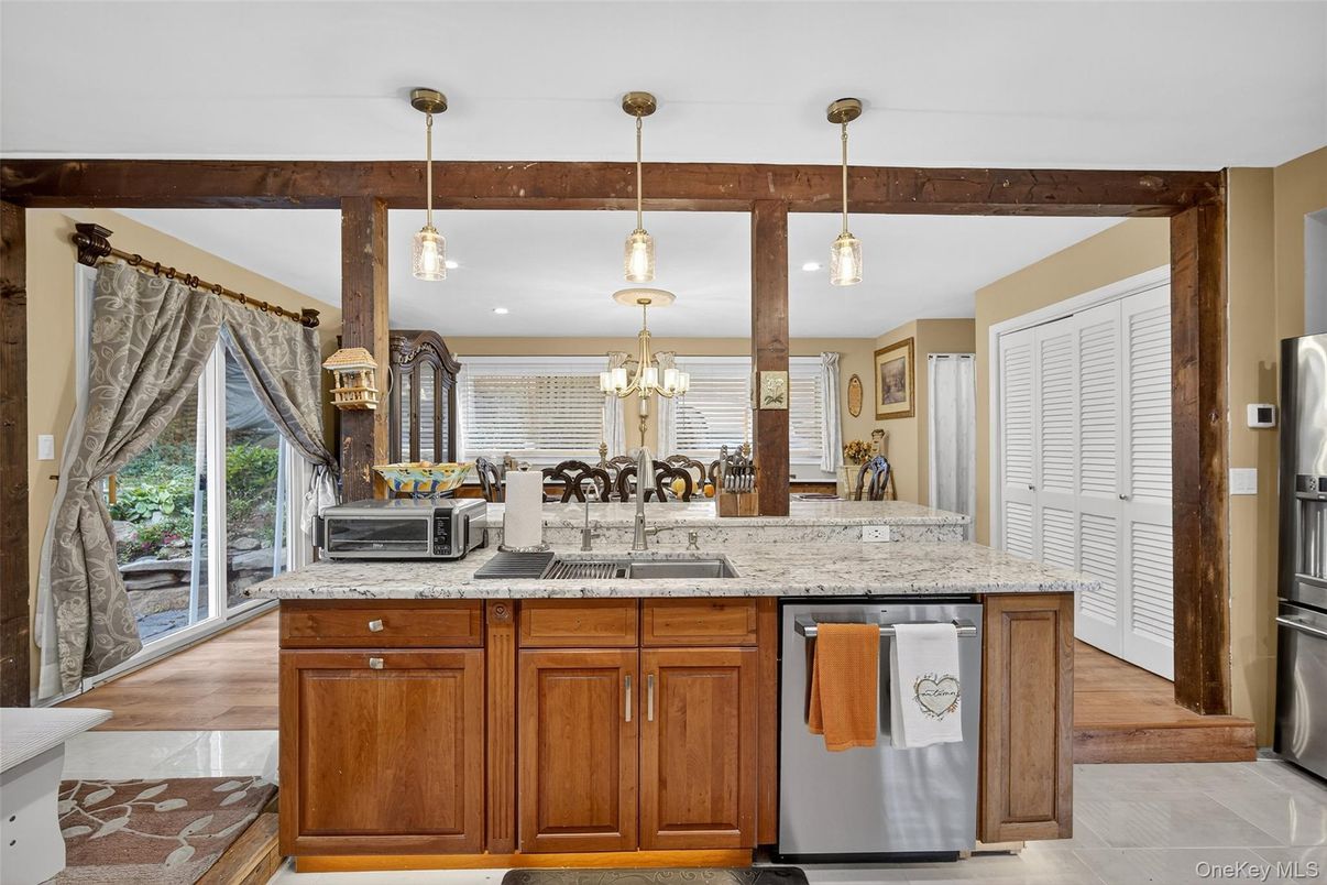 Chandelier, Dining room, Interior, Kitchen, Pendant Lights, Recessed Lighting, Stainless Steel Appliances, Wood Texture Flooring