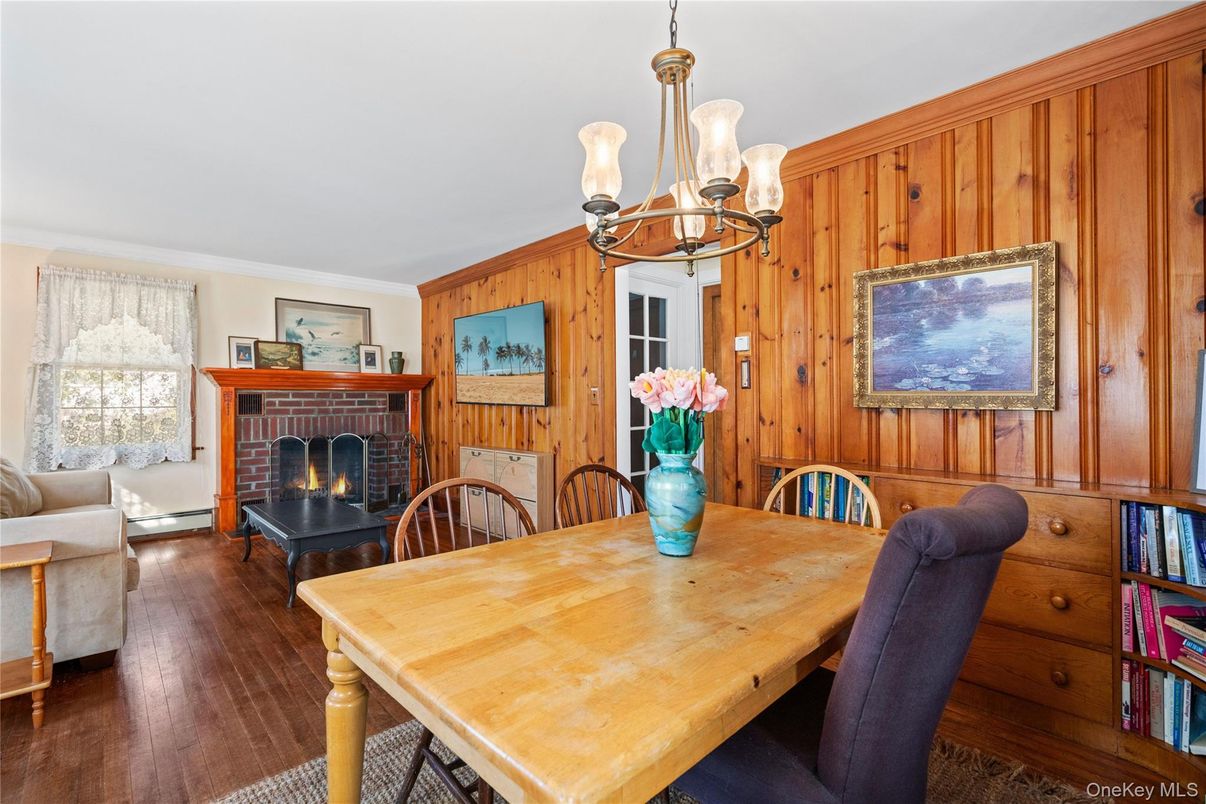 Chandelier, Dining room, Fireplace, Interior, Living room, Wood Texture Flooring, Wooden Walls