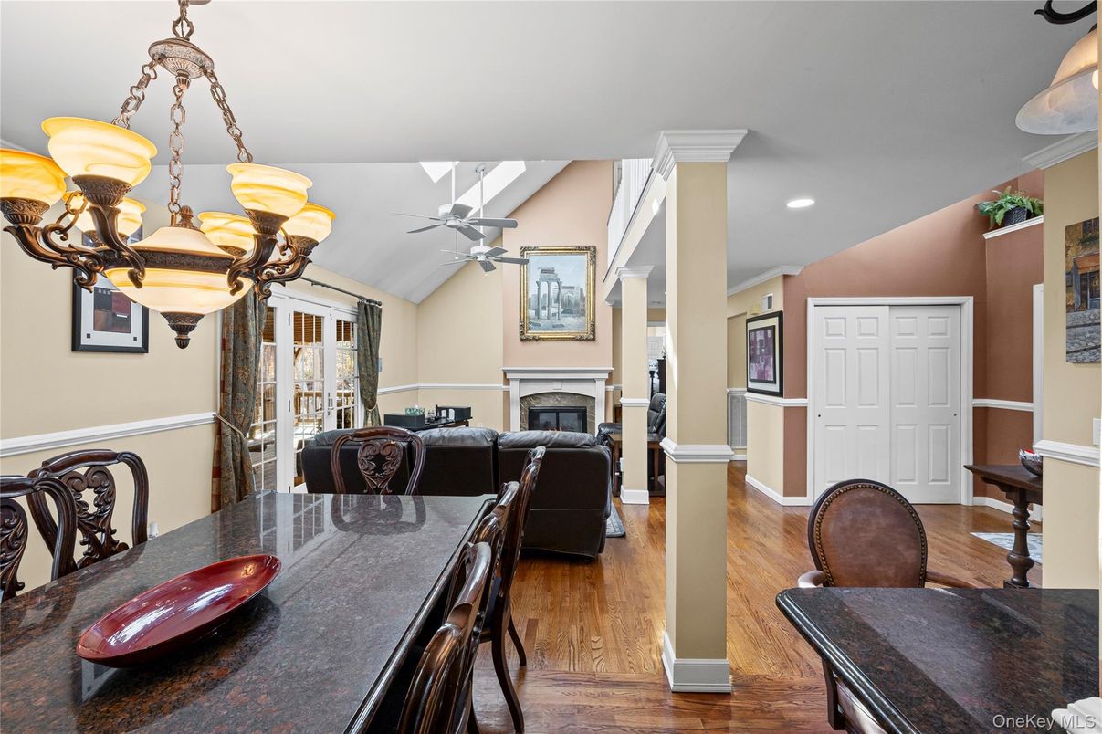 Chandelier, Dining room, Fireplace, Interior, Living room, Recessed Lighting, Wood Texture Flooring