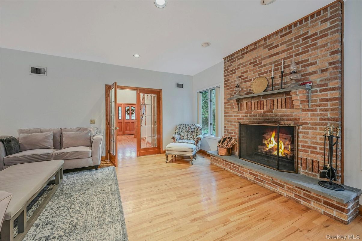 Fireplace, Interior, Living room, Recessed Lighting, Stone Walls, Wood Texture Flooring