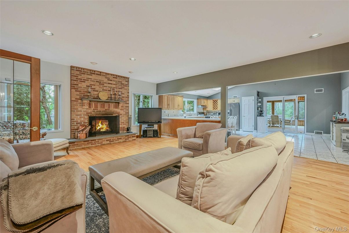 Fireplace, Interior, Kitchen, Living room, Recessed Lighting, Stone Walls, Wood Texture Flooring