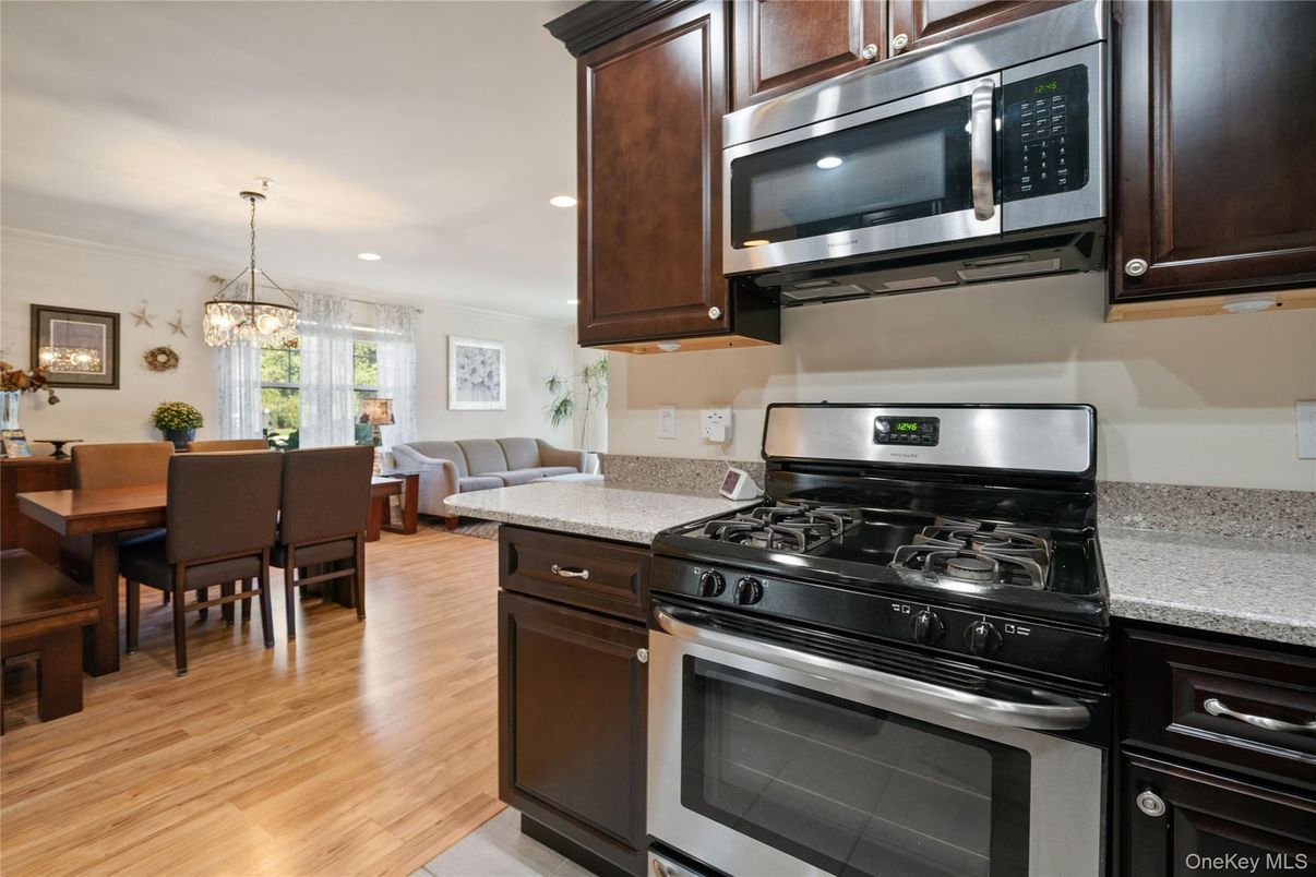 Dining room, Interior, Kitchen, Pendant Lights, Recessed Lighting, Stainless Steel Appliances, Wood Texture Flooring