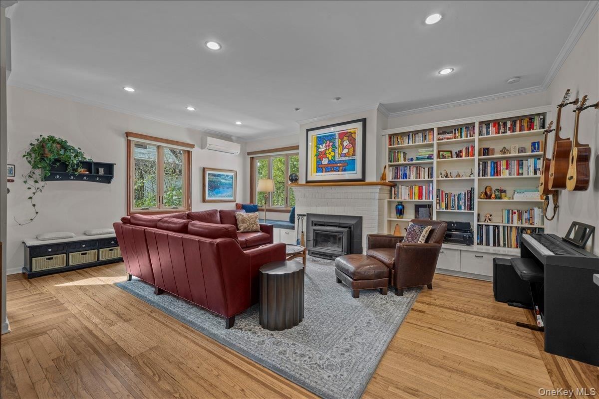 Fireplace, Interior, Living room, Piano, Recessed Lighting, Wood Texture Flooring