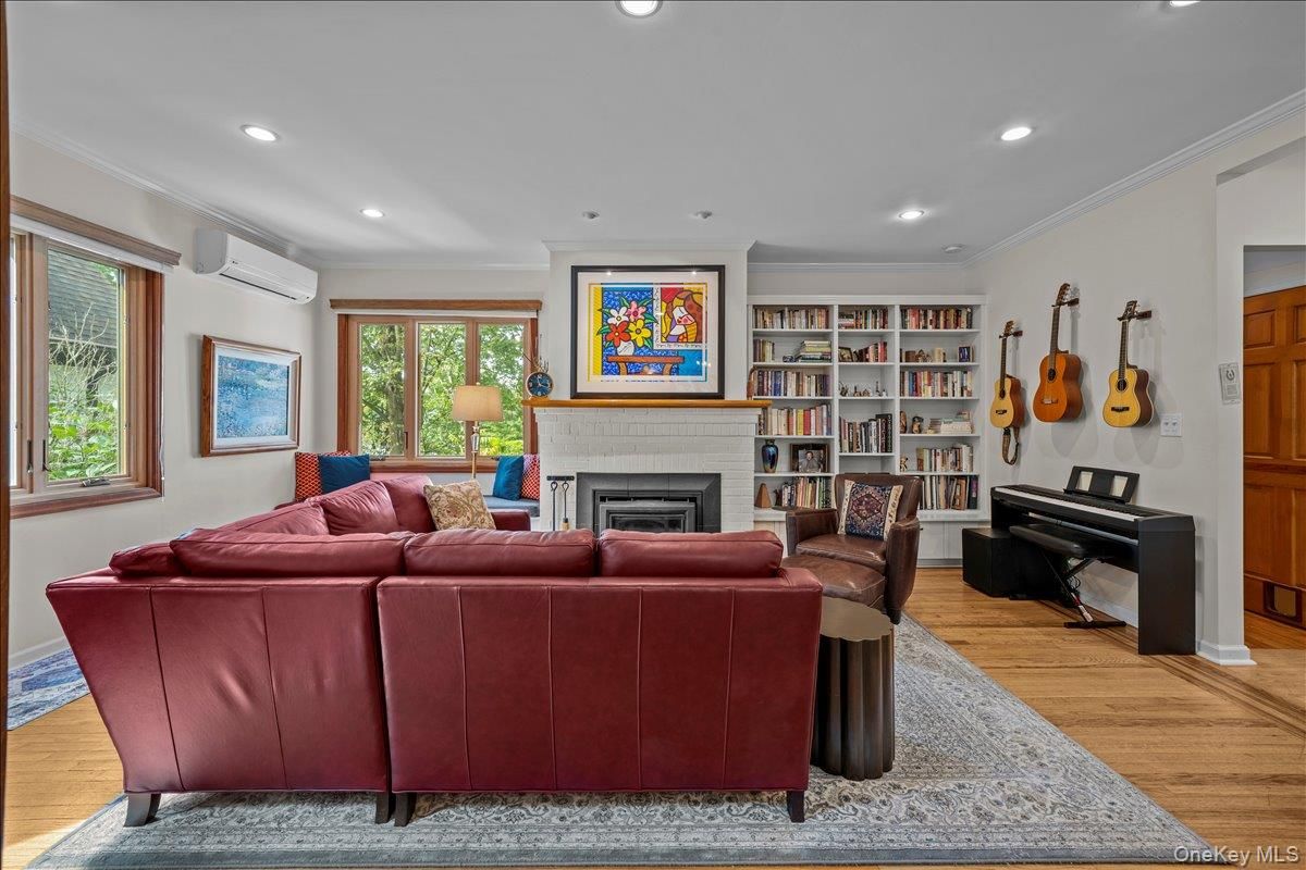 Fireplace, Interior, Living room, Piano, Recessed Lighting, Wood Texture Flooring