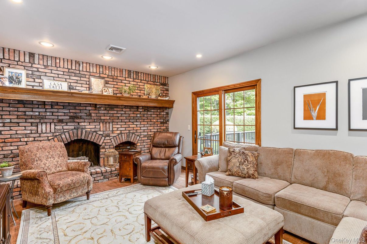 Fireplace, Interior, Living room, Recessed Lighting, Stone Walls, Wood Texture Flooring