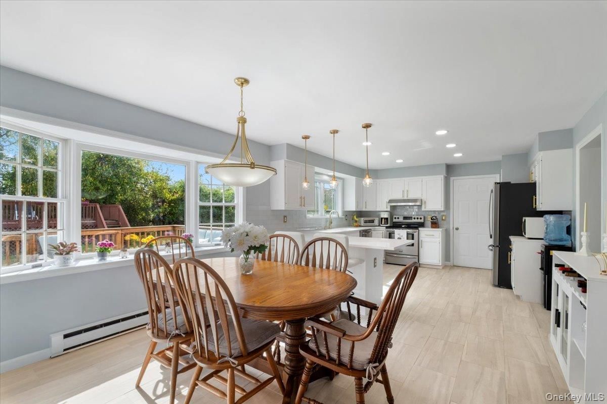 Dining room, Interior, Kitchen, Pendant Lights, Recessed Lighting, Stainless Steel Appliances, Wood Texture Flooring