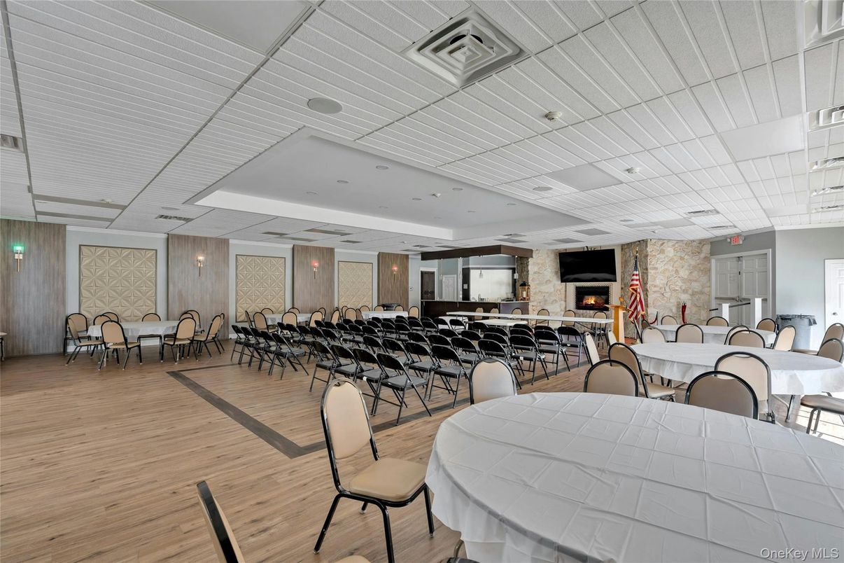 Dining room, Fireplace, Interior, Recessed Lighting, Stone Walls, Wood Texture Flooring