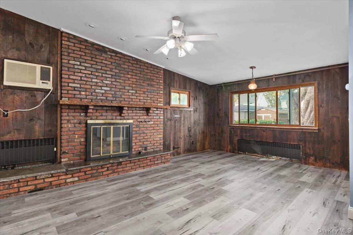 Empty room, Fireplace, Interior, Pendant Lights, Stone Walls, Wood Texture Flooring, Wooden Walls