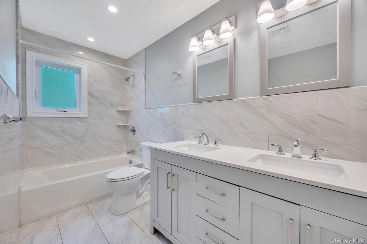 Bathroom, Dual Sink Vanities, Interior, Marble, Marble Walls, Recessed Lighting