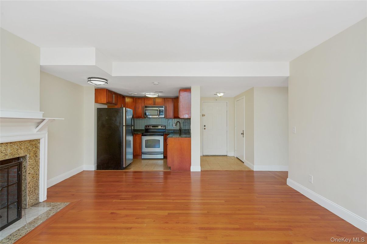 Fireplace, Interior, Kitchen, Stainless Steel Appliances, Wood Texture Flooring