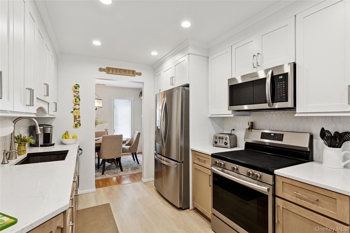 Dining room, Interior, Kitchen, Recessed Lighting, Stainless Steel Appliances, Wood Texture Flooring