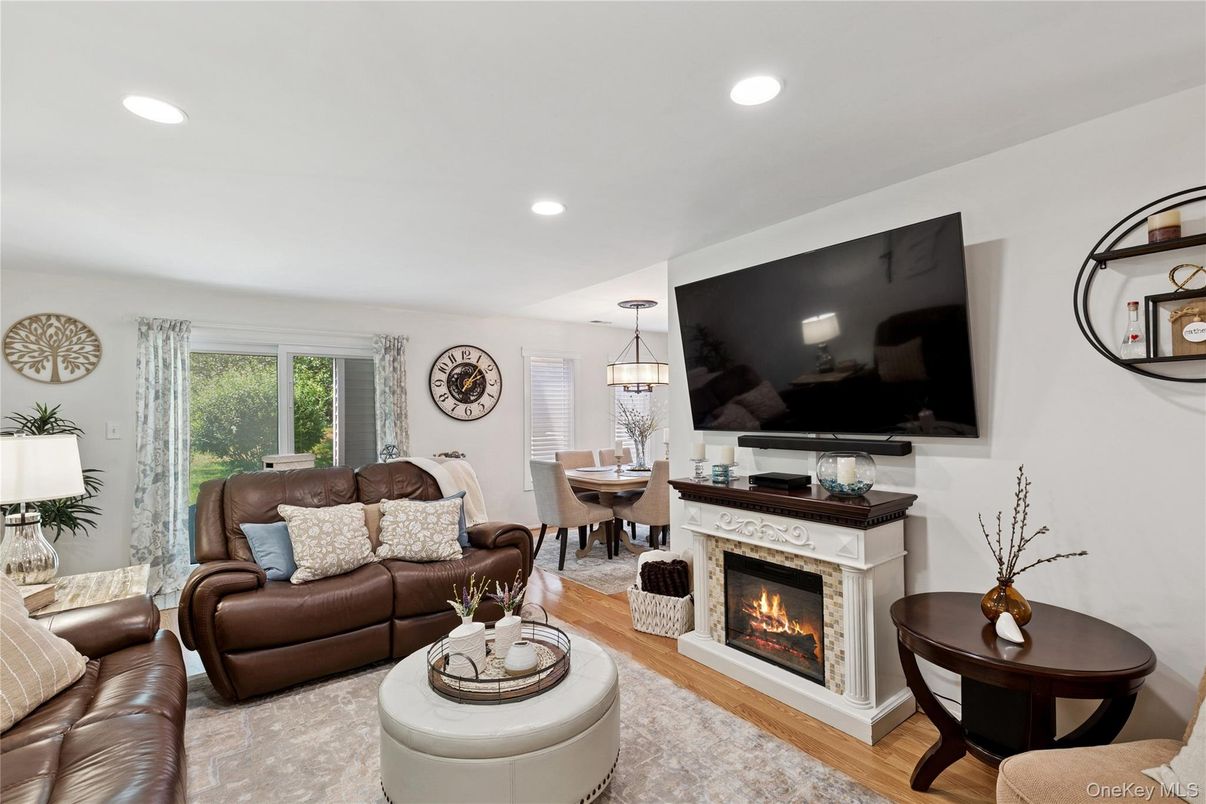 Dining room, Fireplace, Interior, Living room, Pendant Lights, Recessed Lighting, Wood Texture Flooring