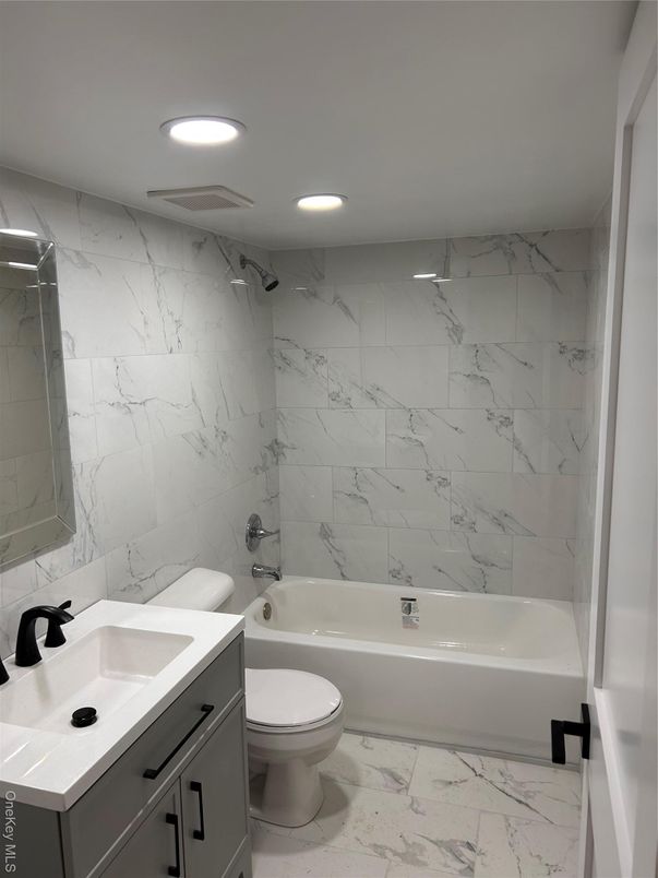 Bathroom, Dual Sink Vanities, Interior, Marble, Marble Walls, Recessed Lighting