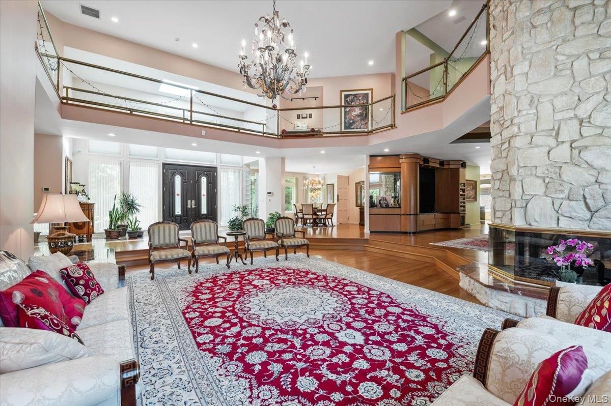 Chandelier, Dining room, Interior, Living room, Recessed Lighting, Stone Walls, Wood Texture Flooring