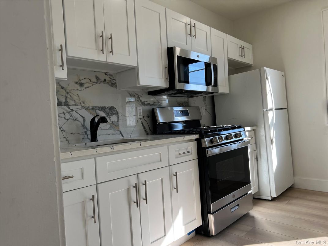 Interior, Kitchen, Marble Walls, Stainless Steel Appliances, Wood Texture Flooring