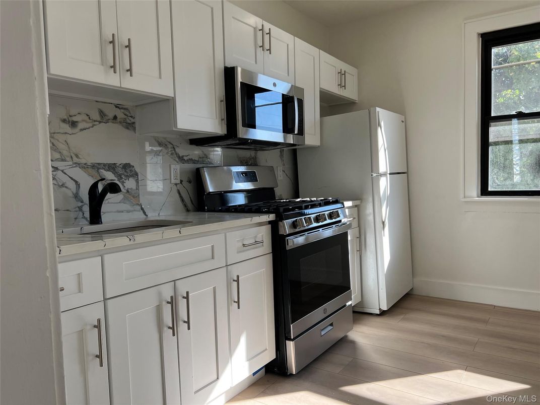 Interior, Kitchen, Marble Walls, Stainless Steel Appliances, Wood Texture Flooring