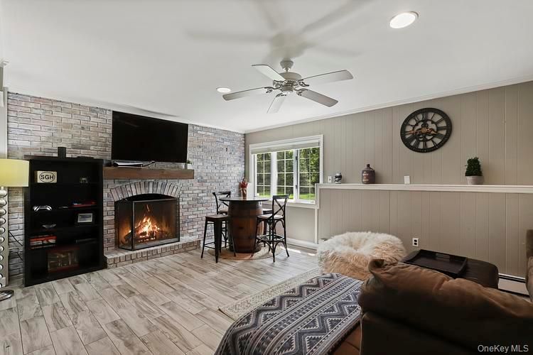 Dining room, Fireplace, Interior, Recessed Lighting, Stone Walls, Wood Texture Flooring