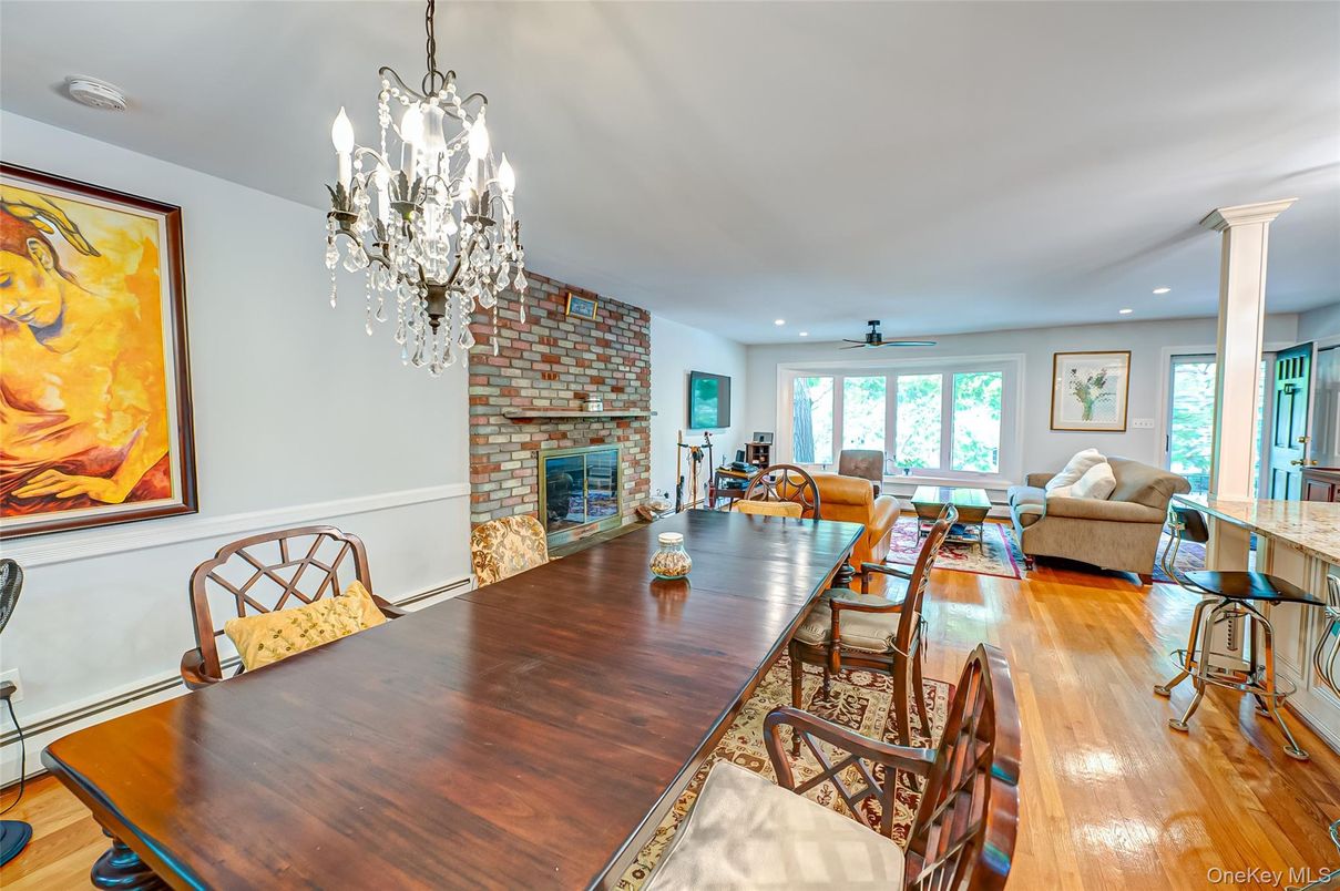 Chandelier, Dining room, Fireplace, Interior, Living room, Recessed Lighting, Stone Walls, Wood Texture Flooring