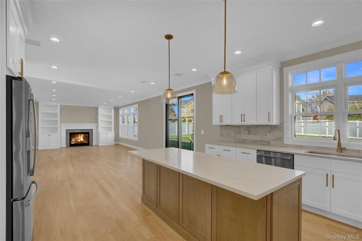 Fireplace, Interior, Kitchen, Pendant Lights, Recessed Lighting, Stainless Steel Appliances, Wood Texture Flooring