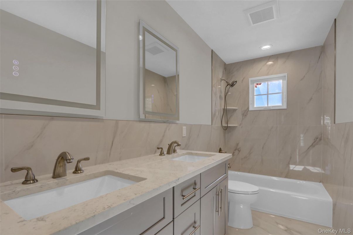 Bathroom, Dual Sink Vanities, Interior, Marble Walls, Recessed Lighting