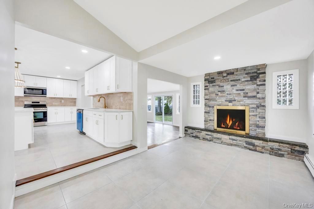 Fireplace, Interior, Kitchen, Pendant Lights, Recessed Lighting, Stainless Steel Appliances, Stone Walls