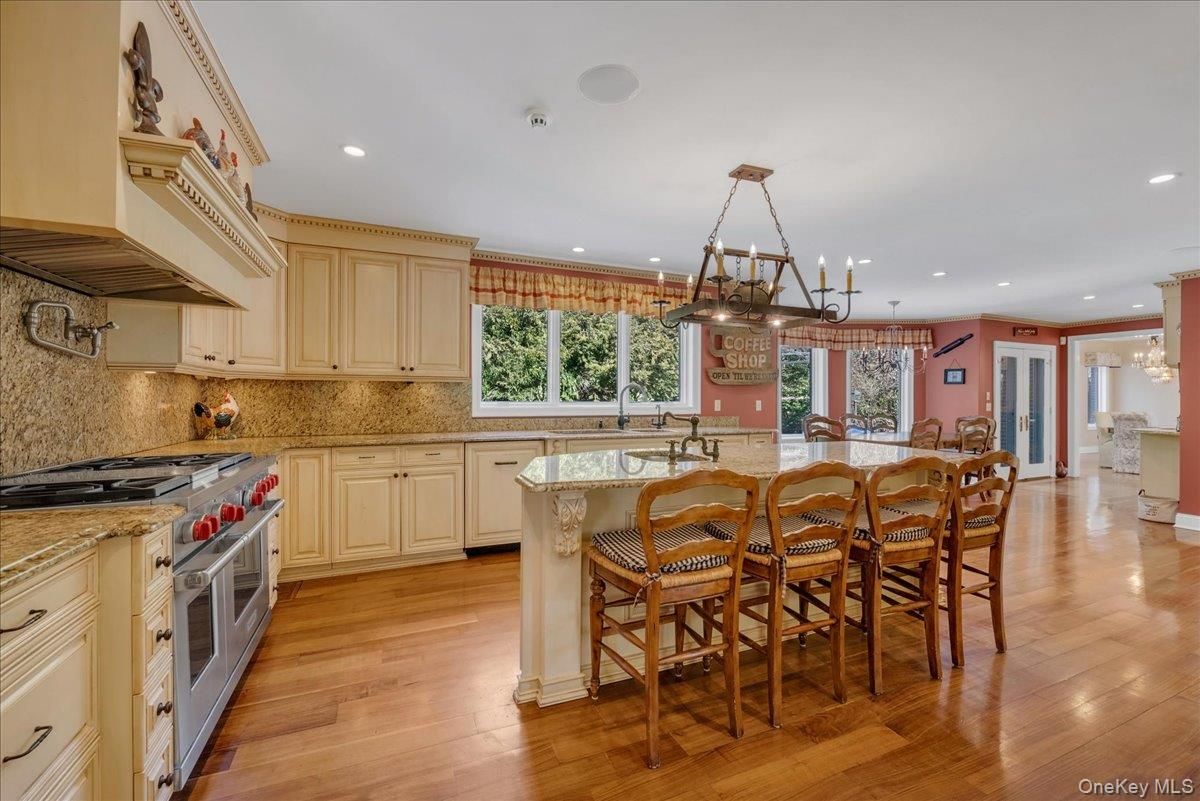 Chandelier, Dining room, Interior, Kitchen, Pendant Lights, Recessed Lighting, Stainless Steel Appliances, Wood Texture Flooring