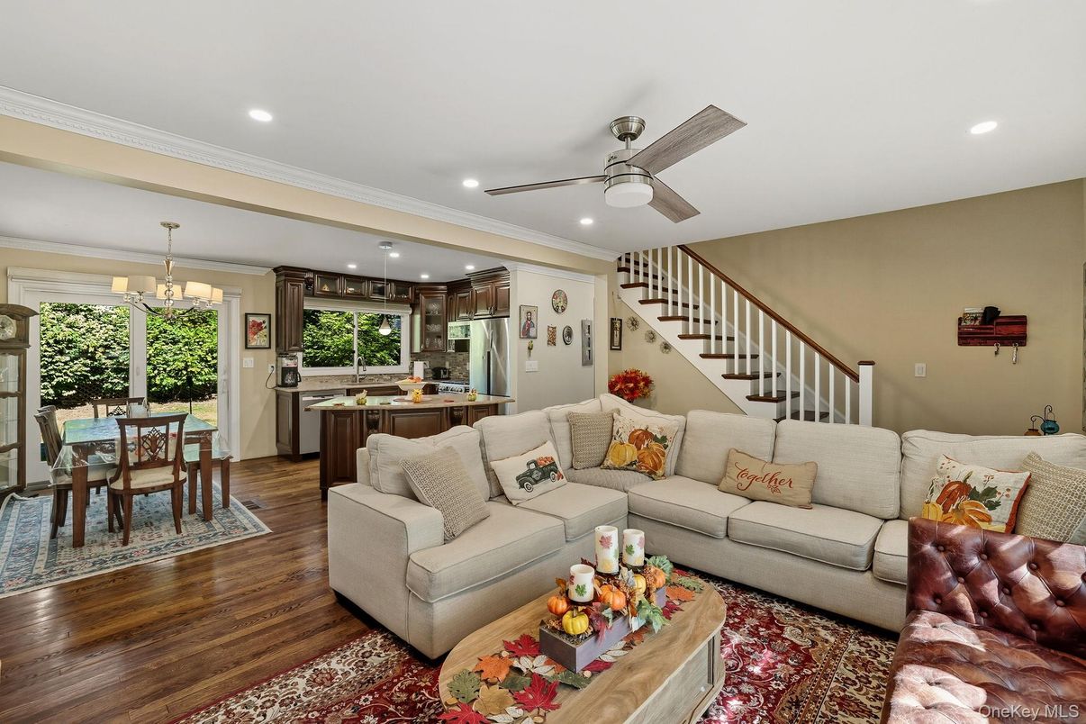 Chandelier, Dining room, Interior, Kitchen, Living room, Pendant Lights, Recessed Lighting, Stainless Steel Appliances, Wood Texture Flooring