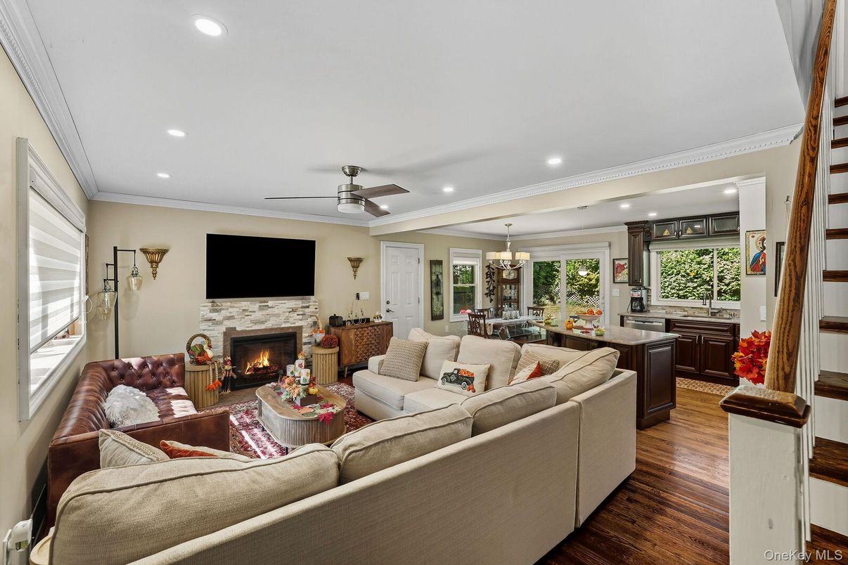 Chandelier, Dining room, Fireplace, Interior, Living room, Recessed Lighting, Wood Texture Flooring