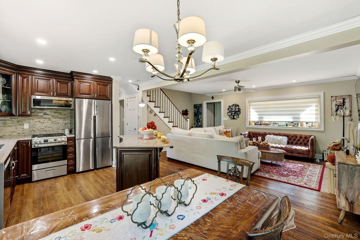 Chandelier, Interior, Kitchen, Living room, Recessed Lighting, Stainless Steel Appliances, Wood Texture Flooring