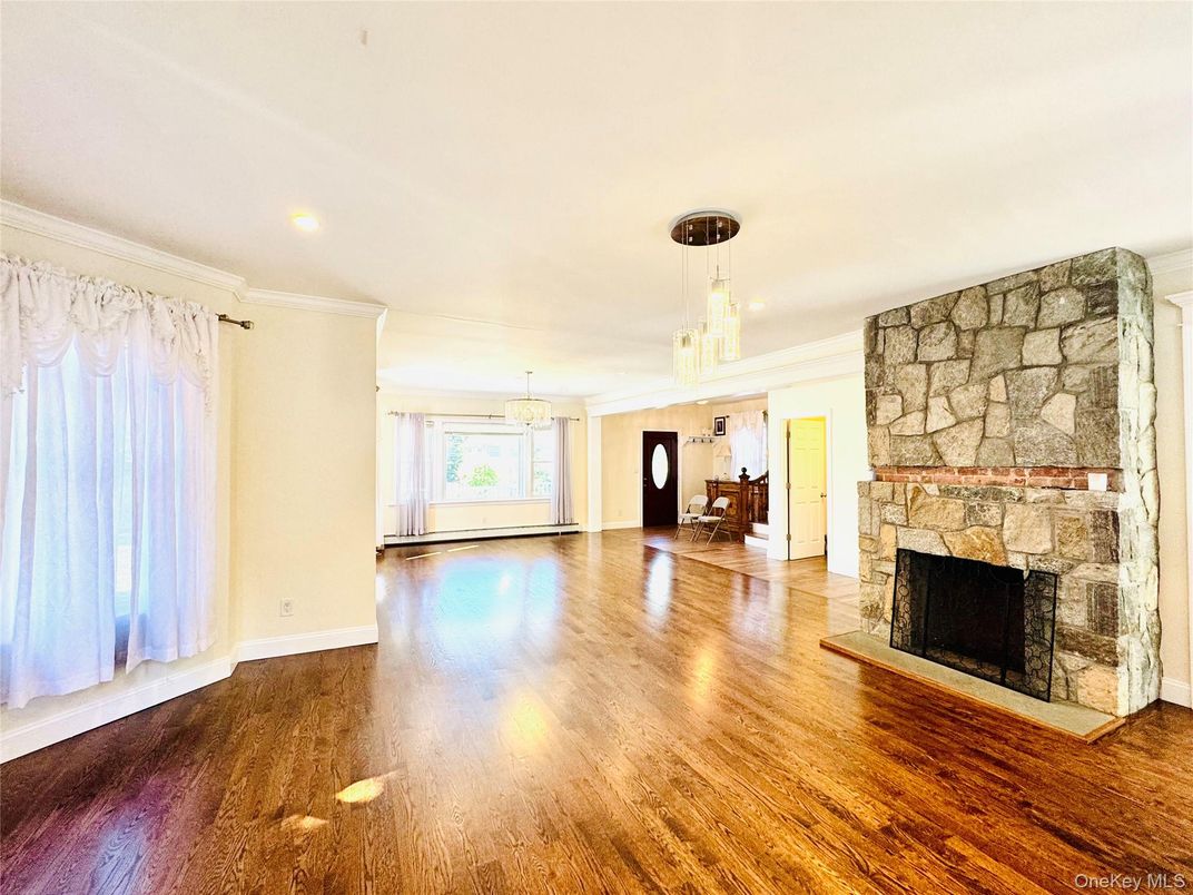 Empty room, Fireplace, Interior, Pendant Lights, Recessed Lighting, Stone Walls, Wood Texture Flooring