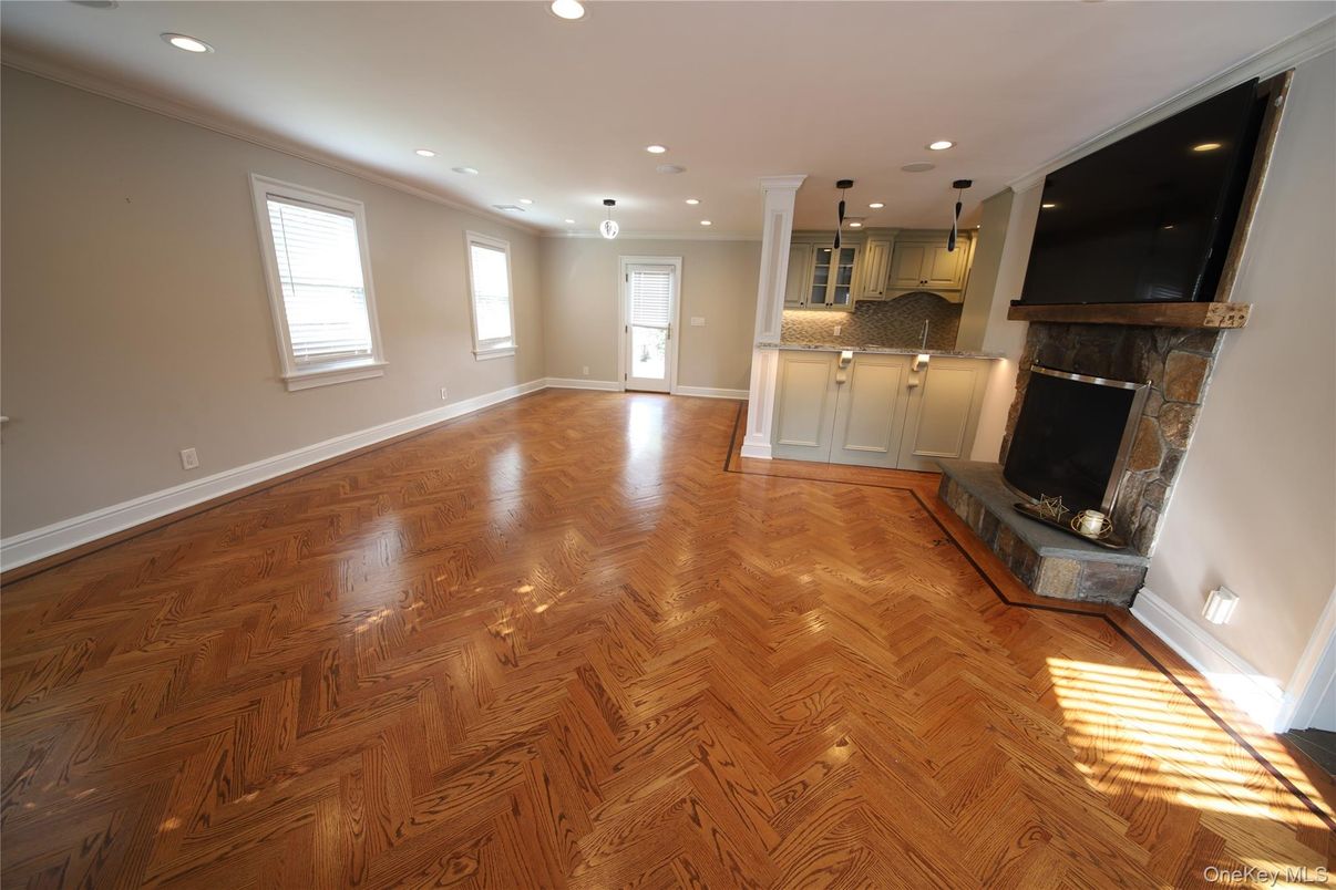 Empty room, Fireplace, Interior, Kitchen, Pendant Lights, Recessed Lighting, Wood Texture Flooring