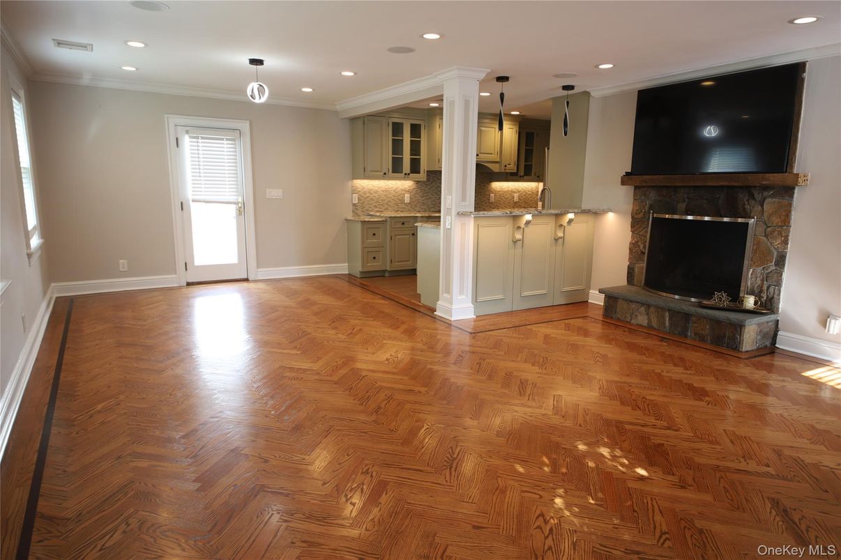 Empty room, Fireplace, Interior, Kitchen, Pendant Lights, Recessed Lighting, Wood Texture Flooring